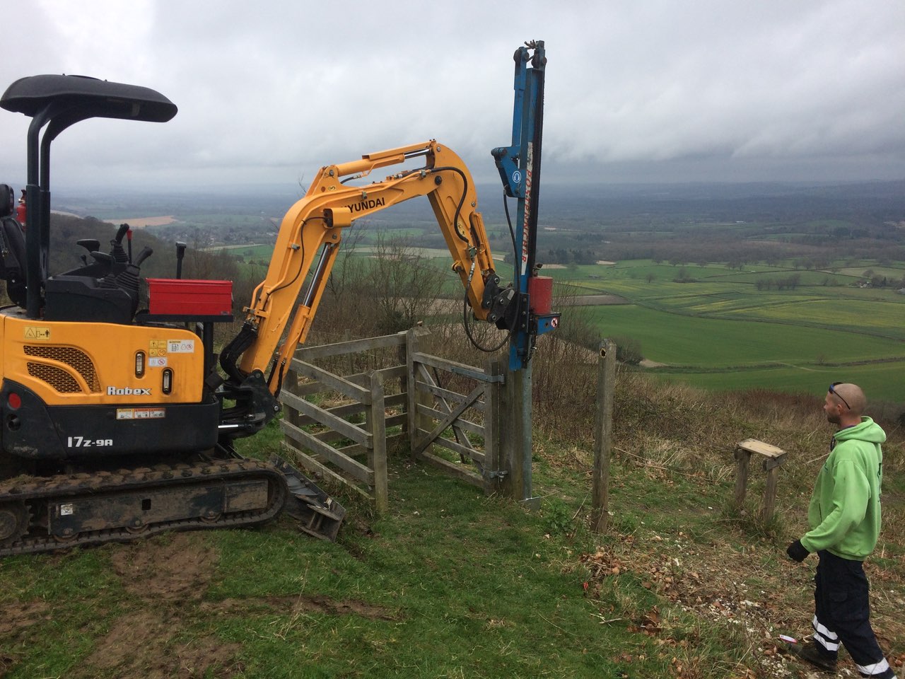  Knocking in Clipex fence posts with a beautiful view 